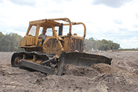 Photo of bulldozer in federal excess property program