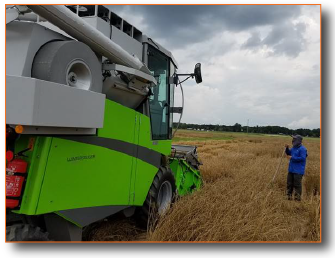 Photo of machine harvesting wheat